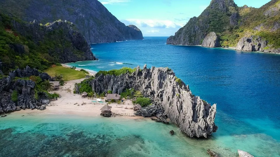 A remote island coastline of cliffs and beach
